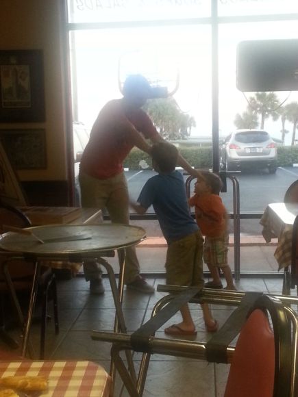 Holding two little boys at bay had the big boy laughing!